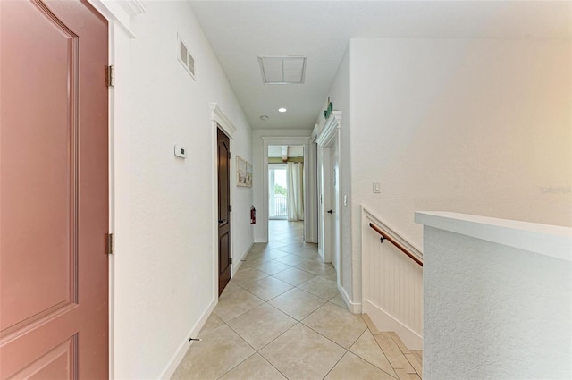 hallway featuring light tile patterned floors