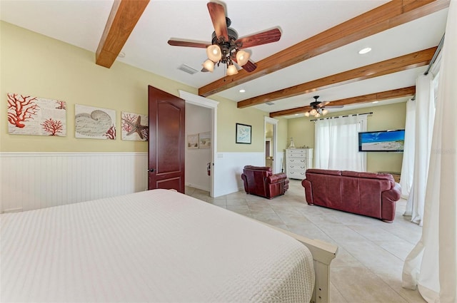 tiled bedroom with ceiling fan and beam ceiling