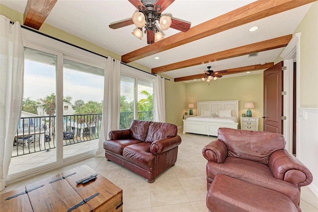 tiled living room with ceiling fan and beam ceiling