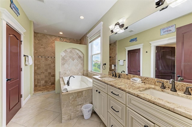 bathroom featuring vanity, separate shower and tub, and tile patterned flooring