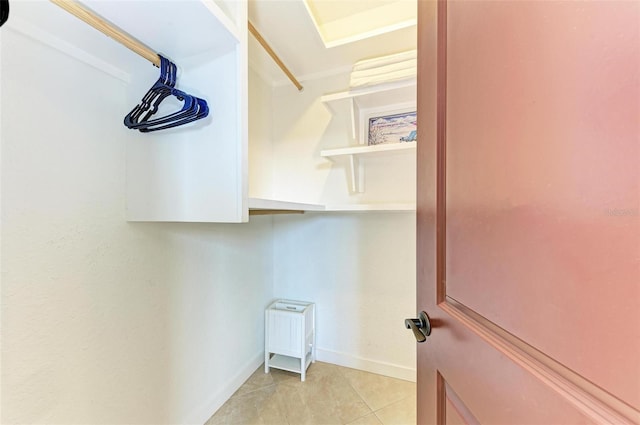 spacious closet with light tile patterned flooring