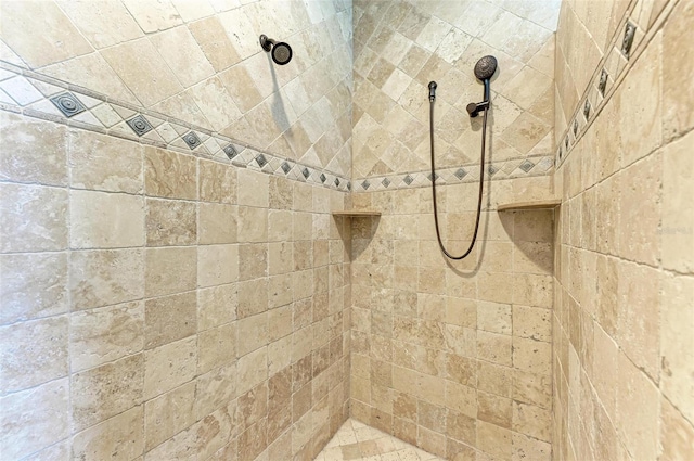 bathroom with tiled shower