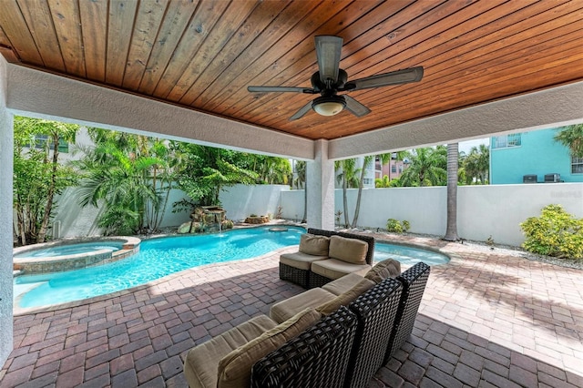 view of pool with pool water feature, an in ground hot tub, ceiling fan, and a patio area