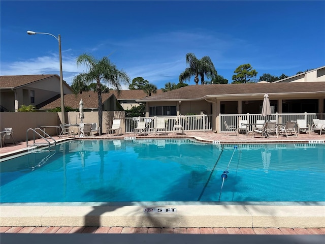 view of swimming pool featuring a patio