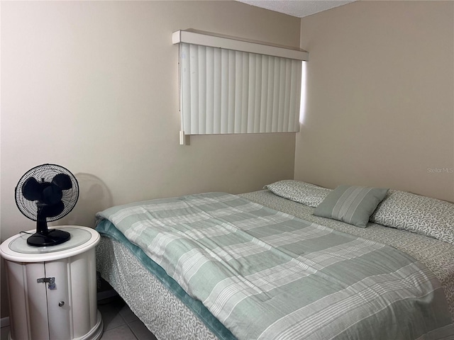 bedroom with tile patterned floors