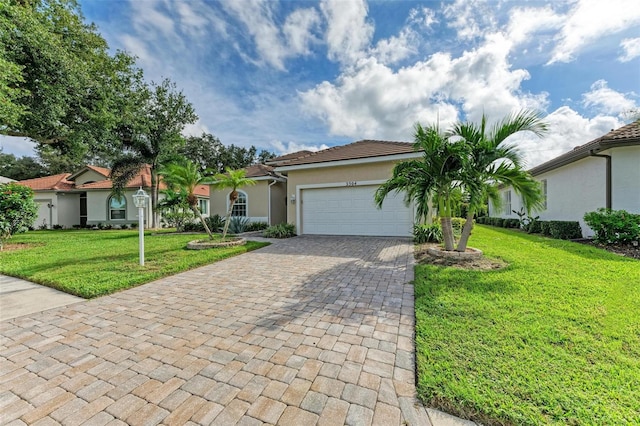 view of front of property featuring a garage and a front yard