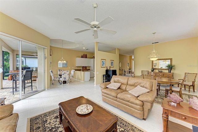 living room featuring ceiling fan and light tile patterned floors