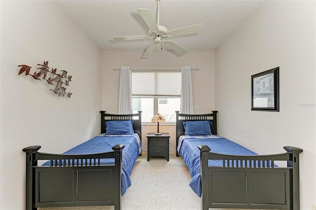 bedroom with ceiling fan and carpet floors