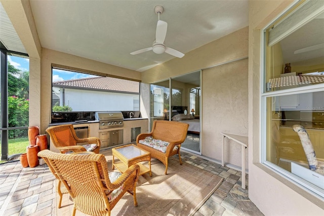 sunroom / solarium with ceiling fan