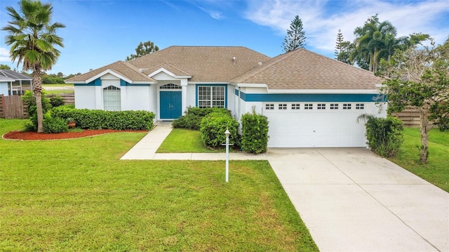 ranch-style house with a front lawn and a garage