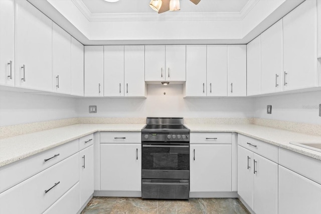 kitchen featuring ornamental molding, light countertops, white cabinets, and stainless steel range with electric cooktop