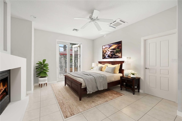 bedroom with light tile patterned floors, access to exterior, and ceiling fan