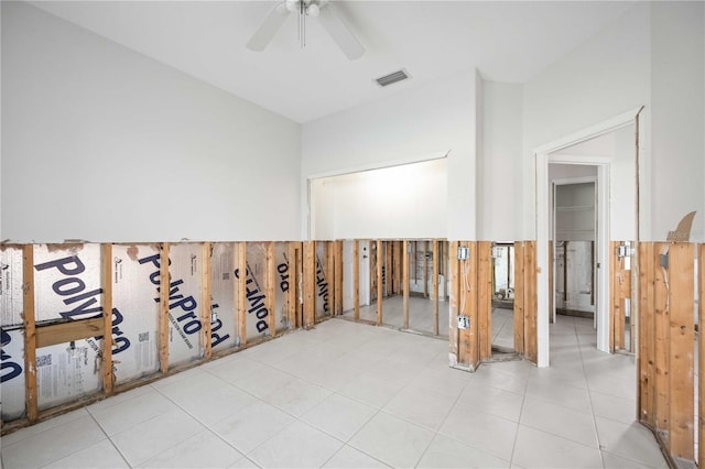 empty room featuring light tile patterned floors and ceiling fan