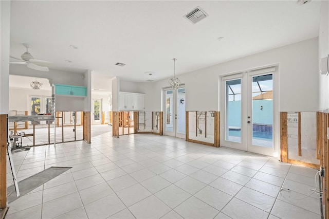 spare room featuring ceiling fan, light tile patterned floors, and french doors