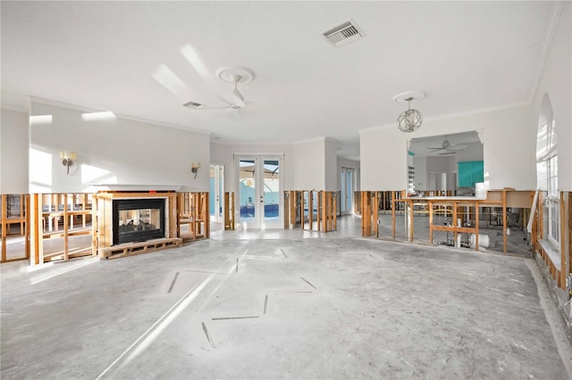 unfurnished living room with ornamental molding, a multi sided fireplace, and ceiling fan