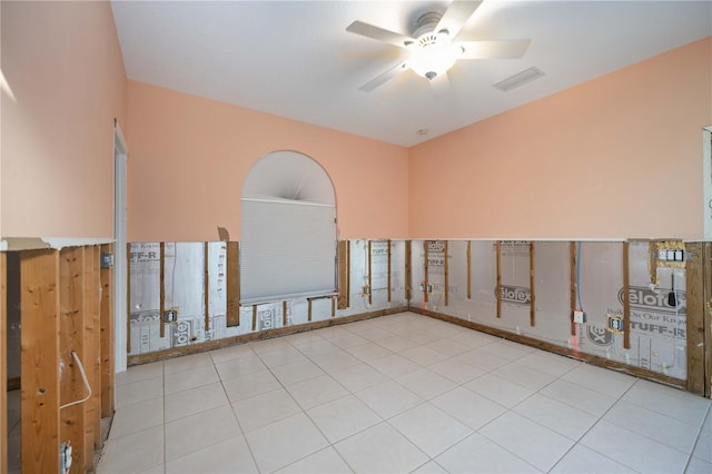 unfurnished room featuring light tile patterned floors and ceiling fan