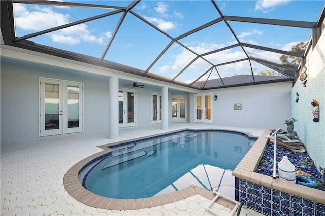 view of pool featuring a lanai, ceiling fan, and a patio area