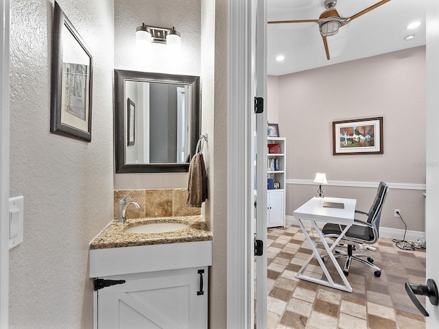 bathroom with vanity, tasteful backsplash, and ceiling fan