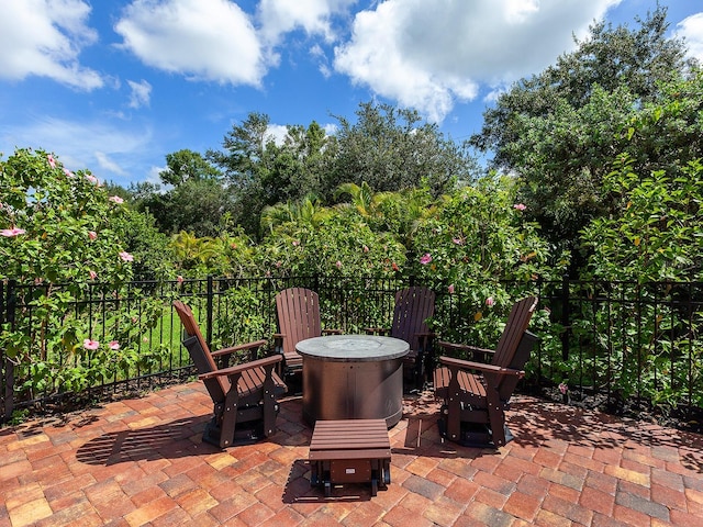 view of patio with a fire pit