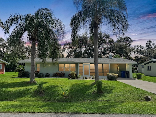 view of front of house with a lawn