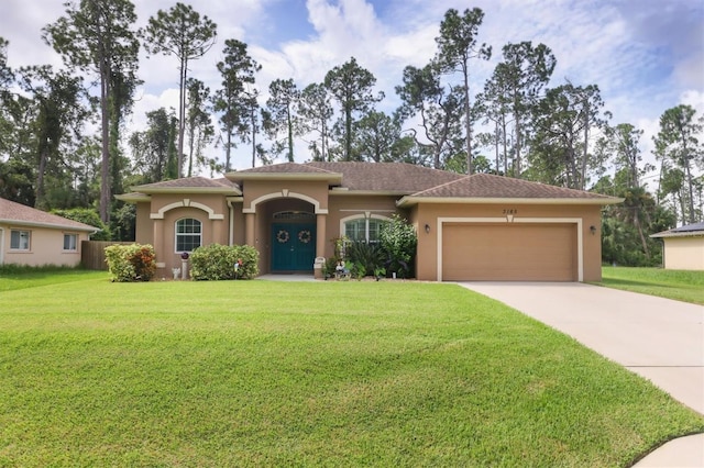 view of front of property featuring a front lawn and a garage