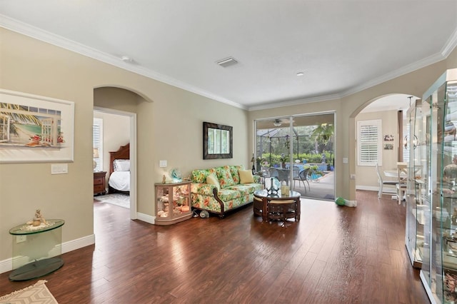 living room with crown molding and dark wood-type flooring