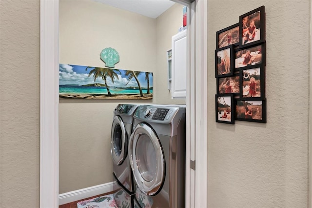 clothes washing area featuring washing machine and clothes dryer