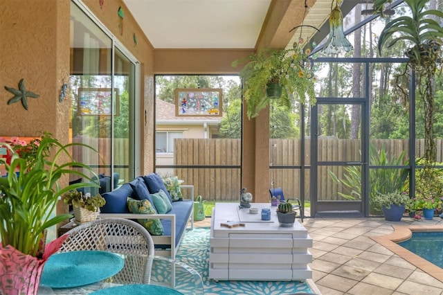 sunroom / solarium featuring a healthy amount of sunlight