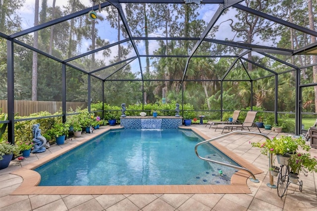 view of pool with pool water feature, a lanai, and a patio