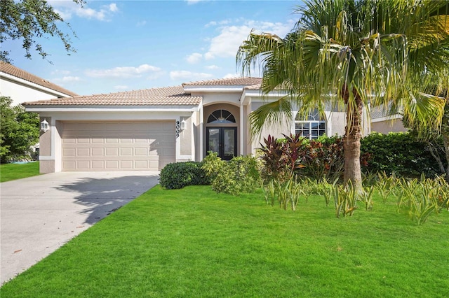 view of front of house with a garage and a front lawn