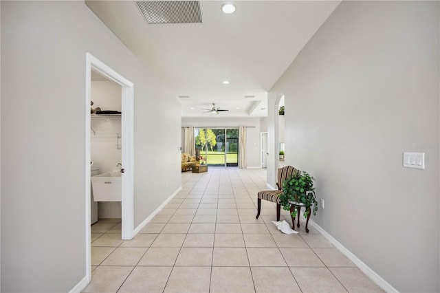 hallway with light tile patterned flooring