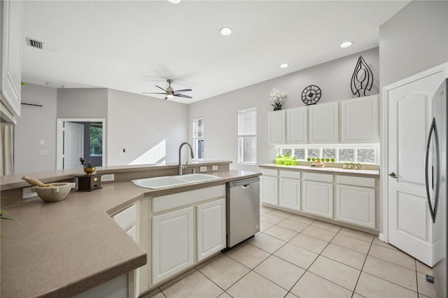 kitchen featuring white cabinetry, sink, a healthy amount of sunlight, and appliances with stainless steel finishes