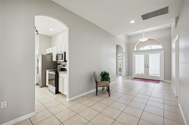 tiled entryway with french doors