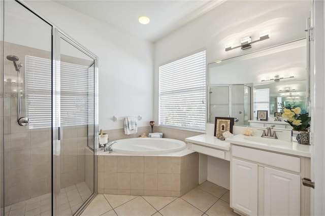 bathroom featuring vanity, separate shower and tub, and tile patterned floors