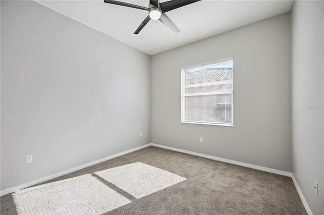 carpeted empty room with ceiling fan