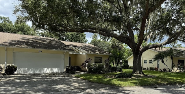 ranch-style house with a front lawn and a garage