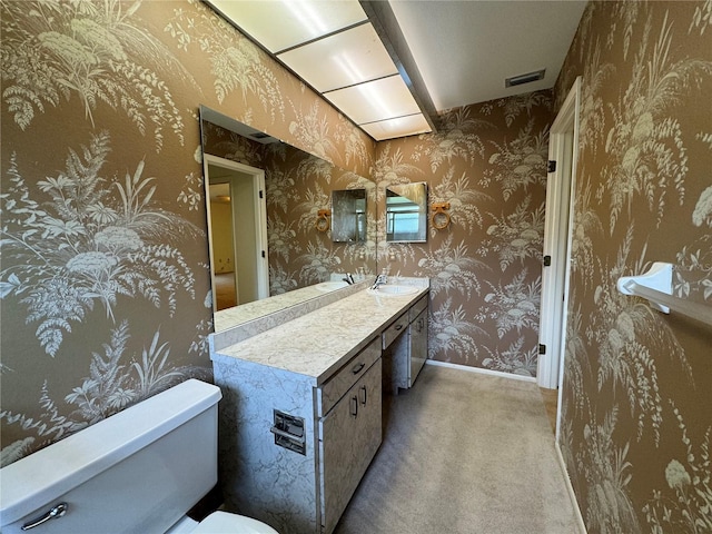 bathroom with vanity and toilet