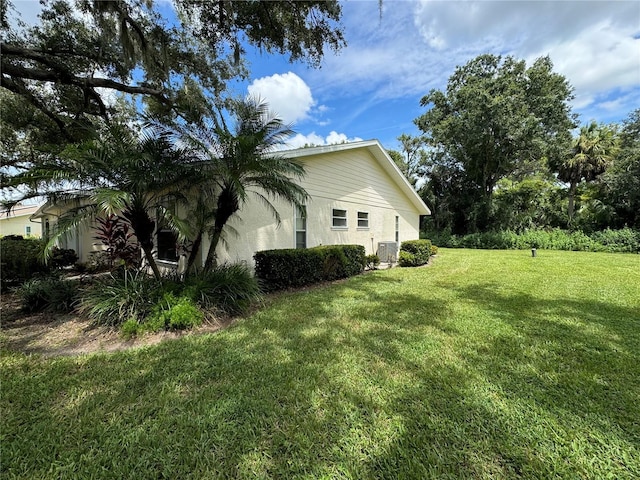 view of property exterior with a yard