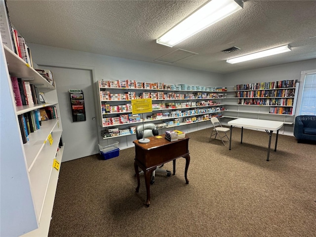 office featuring a textured ceiling and carpet flooring