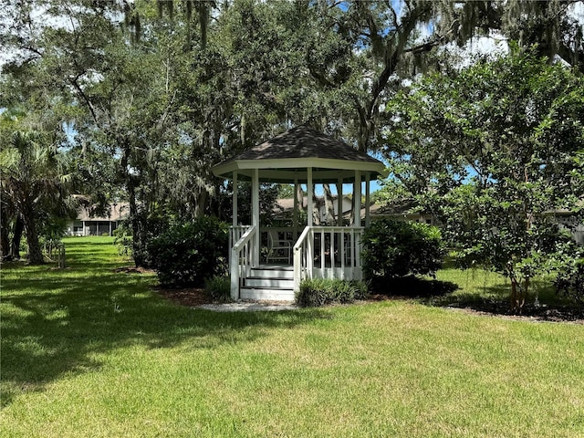 exterior space with a lawn and a gazebo