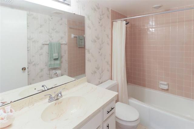 full bathroom with vanity, shower / bath combo with shower curtain, toilet, and wallpapered walls