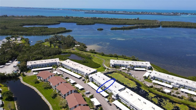 birds eye view of property with a water view