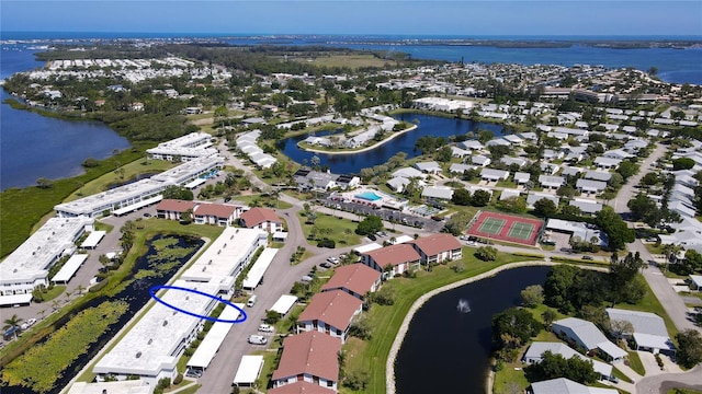 bird's eye view with a water view and a residential view