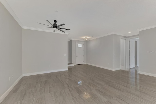 empty room with crown molding, ceiling fan, baseboards, and recessed lighting