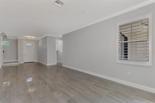 interior space featuring ornamental molding and light wood-type flooring