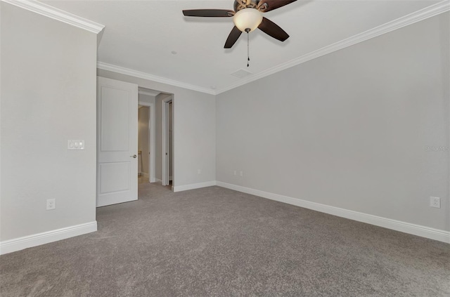 spare room with ornamental molding, ceiling fan, and carpet floors