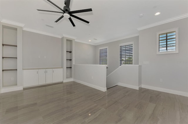 spare room featuring ornamental molding, hardwood / wood-style floors, and ceiling fan