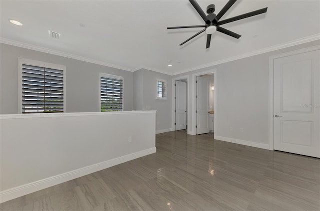 unfurnished room featuring crown molding, hardwood / wood-style flooring, and ceiling fan