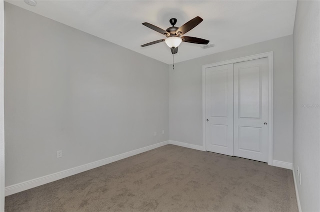 unfurnished bedroom with light carpet, ceiling fan, and a closet