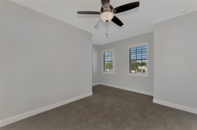 carpeted empty room featuring ceiling fan